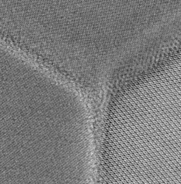 An atomic-resolution scanning transmission electron microscope image of a triple junction of grains in cubic silicon nitride. The thickness of the grain boundaries is less than one nanometre. Credit: Norimasa Nishiyama, DESY/Tokyo Tech