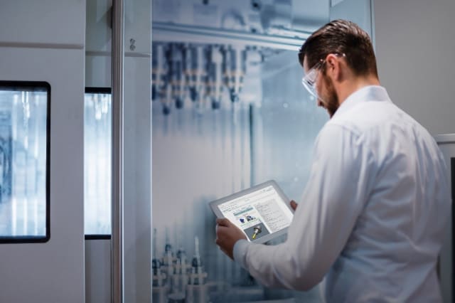 Thanks to the digital thread, this user has access to all machine tool operations from his tablet. (Image courtesy of Siemens.)