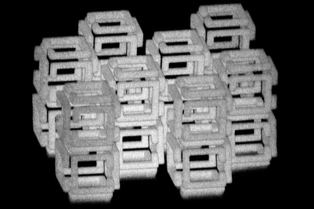 MIT engineers have devised a way to create 3-D nanoscale objects by patterning a larger structure with a laser and then shrinking it. This image shows a complex structure prior to shrinking. (Image courtesy Daniel Oran/MIT.)