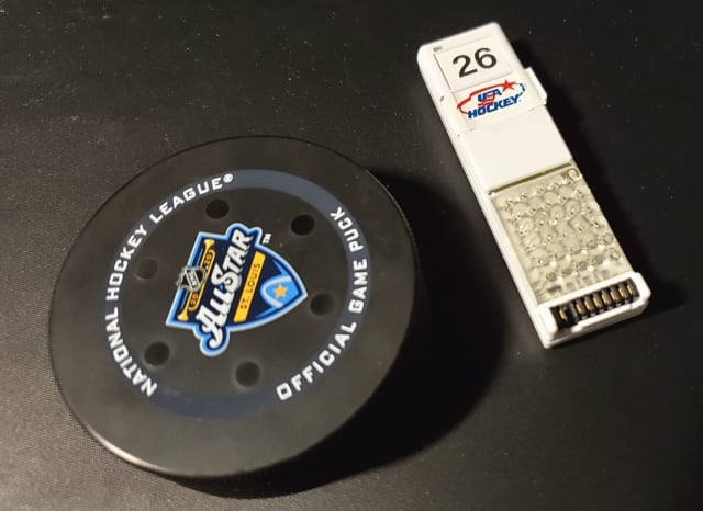 Smart puck (left) and player tag (right). (Image courtesy of SMT.)