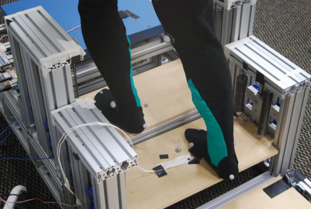 When a person ascending the stairs steps on the sensor on the next tread up, the latch on the lower step releases. The stored energy in the spring is also released, lifting up the back leg. (Image courtesy of Georgia Tech.)