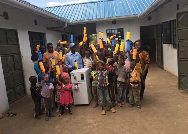 Children enjoy Majik Water’s safe drinking water at a home near Thika. (Image courtesy of Majik Water.)