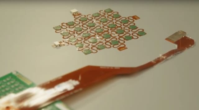 The device is made up of 100 small sensors and is about 1 square centimeter in size. (Image courtesy of National University of Singapore.)