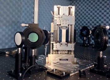 The test apparatus, including the tensile machine and GHz optical equipment. (Image Credit: Peter J. Schemmel, Heriot-Watt University)