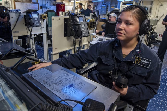 A Navy Petty Officer stands watch in the control station aboard the USS John P. Murtha. (Image Source: The Department of Defense)