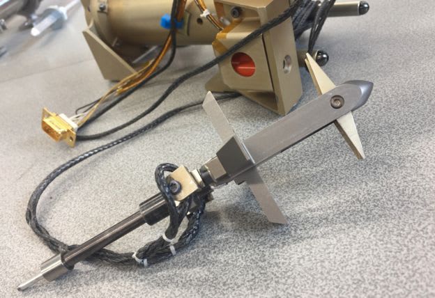 The miniature harpoon to be tested on the mission.