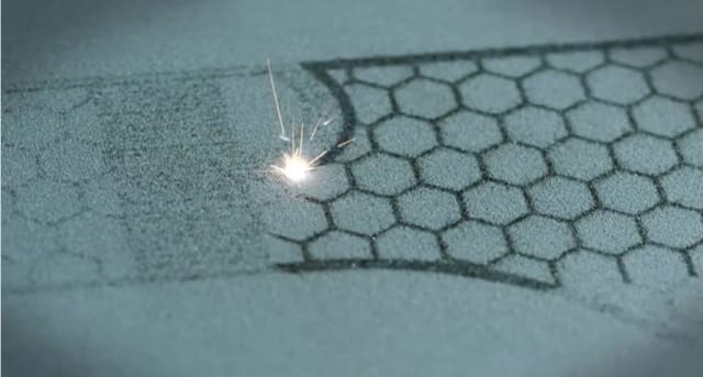Two lasers work in tandem to melt the required shape into the metal powder. Note that while DMLM and Direct Metal Laser Sintering (DMLS) are frequently used interchangeably, the difference is that in DMLS the laser partially melts the metal powder. In DMLM, the metal powder is melted completely. (Image courtesy of GE.)