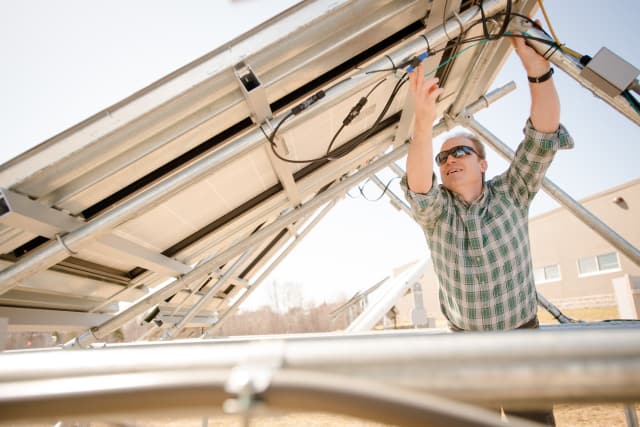Joshua Pearce, professor of materials science and electrical engineering at Michigan Tech, has conducted several studies investigating the benefits of having large-scale solar deployments replace existing coal or nuclear power. (Image courtesy of Sarah Bird/Michigan Tech.)