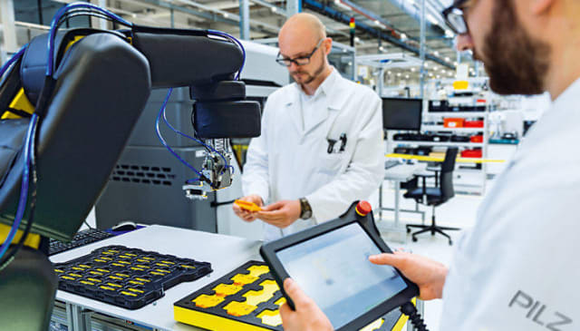Current trends point to a future with humans and robots working side by side. (Image courtesy of PILZ.)