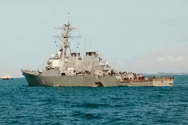 When the collision occurred, the USS John S. McCain’s hull was damaged enough to cause flooding in compartments that contained crew members, machinery and communications rooms. The crew members who were not impacted were able to contain the flooding and prevent further damage from occurring. (Image courtesy of Royal Malaysian Navy via AP.)