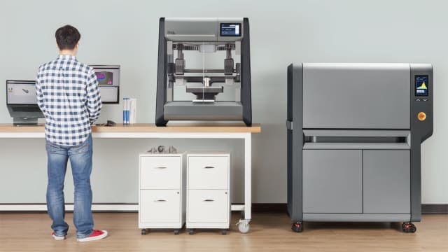 The DM Studio System is described as the first office-friendly metal 3D printer. On the right is the microwave-enhanced sintering furnace. (Image courtesy of Desktop Metal.)