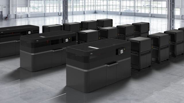 The DM Production System is described as 100 times faster than existing metalpowder bed fusion technologies. (Image courtesy of Desktop Metal.)