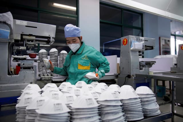 Production of face masks in Shanghai, China. (Image courtesy of Aly Song, Reuters.)