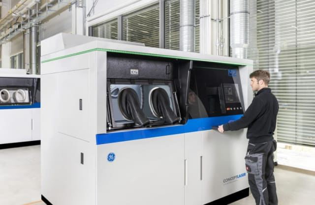 Four previously cast parts will be 3D printed with the Concept Laser M2 Series 5. The dual laser SLM machine features 400 W or 1 kW lasers and a large build volume measuring 245 x 245 x 350 mm. (Image courtesy of GE Additive.)