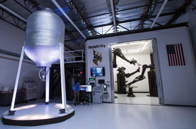 Featuring three industrial robotic arms, Stargate is the largest metal 3D printer in the world. (Image courtesy of Relativity Space.)