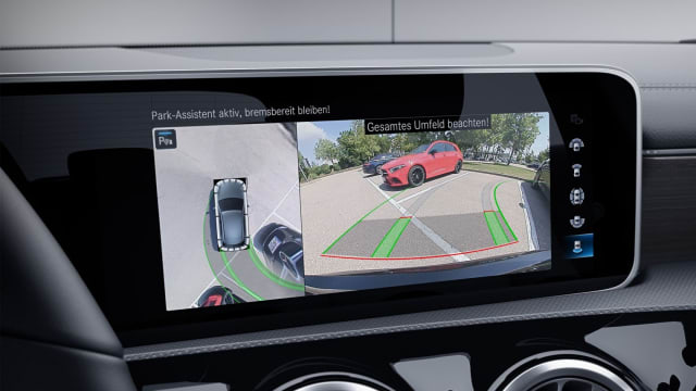 On the left of this Mercedes screen is a 360-degree view created from blending multiple images from separate cameras into one. (Picture courtesy of Mercedes.)