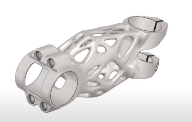 At least it's symmetrical. A generatively designed stem for a road bike. (Picture courtesy of YouTube.)