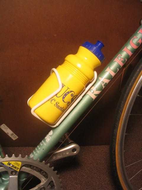 Example of a water bottle cage mounted on a bicycle. (Image courtesy of Wikipedia user Aezram.)