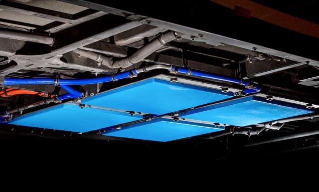 Four inductive charging pads mounted under a Link Transit Bus. (Photo courtesy of Momentum Dynamics.)