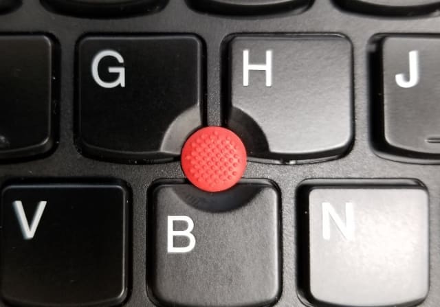 The signature red TrackPoint button on the ThinkPad P52s.