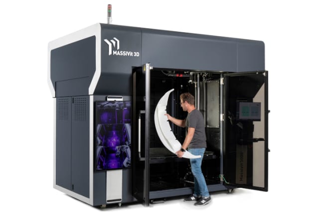 Massive it is. The Massivit 5000 drew crowds at the recent AMUG 2021. Its 57 in x 44 in x 70 in (145 cm x 111 cm x 180 cm) internal build volume is one of industry’s largest. (Picture courtesy of Massivit 3D.)