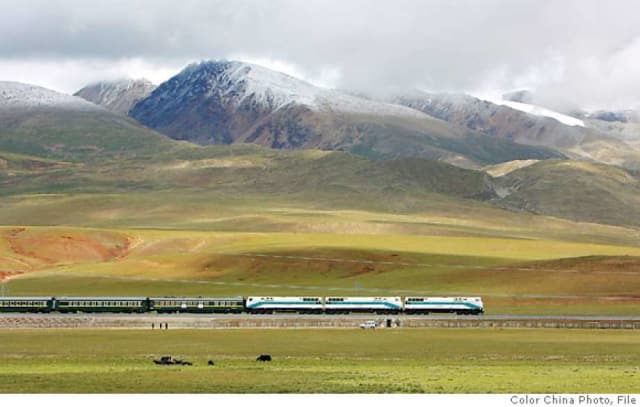 China's Lhasa Express in the Tibetan grass lands near Lhasa.(Image courtesy of AP Photo/Color China Photo.)