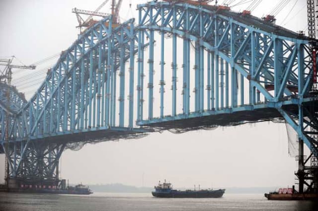 Building bridges: The Dashengguan Yangtze River Bridge under construction A section of the New Silk Road passes through Nanjing, capital of east China's Jiangsu Province on its way to London. (Image courtesy of SCMP.)