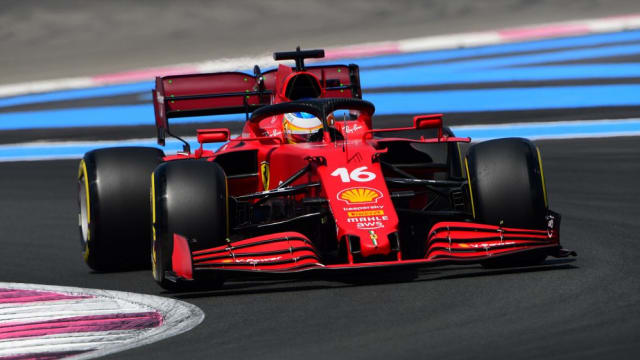 A Ferrari F1 car on the racetrack.