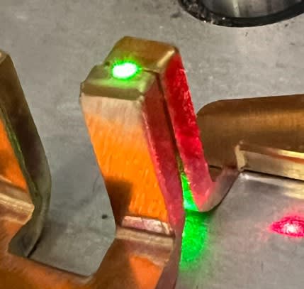 An automated green laser in the process of welding two copper pieces. Source: Interplex