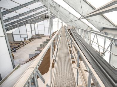 Catwalks, conveyors and support lean-tos are supported within the Agriland FS Inc. fabric facility in Woodbine, Iowa. (Image courtesy Legacy Building Solutions.)