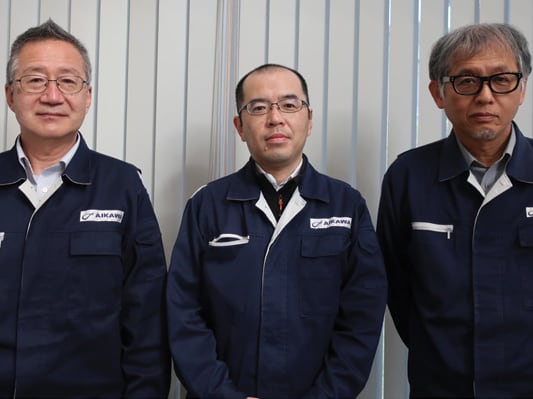 Figure 10. A scene from the interview (Left) Mr. Kazumi Fujita, Director & Senior Managing Executive Officer. (Center) Mr. Hideo Horiike, Product Development Division. (Right) Mr. Makoto Goto, Executive Officer, General Manager of Product Development Division.