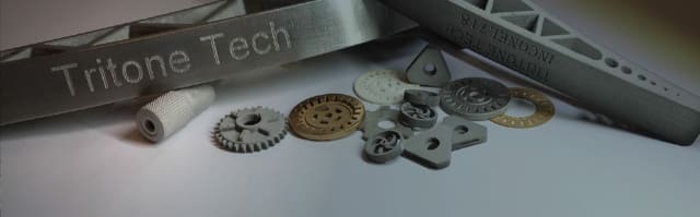 Hints about this new metal 3D printing technology suggest that it could be a binder jetting process. (Image courtesy of Tritone.)