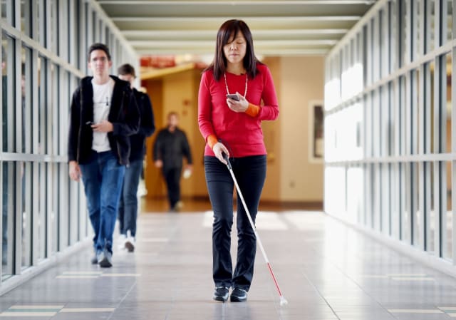 Chieko Asakawa, IBM Distinguished Service Professor in CMU's Robotics Institute and an IBM Fellow at IBM Research, has been legally blind since 14. She helped develop NavCog, a voice-controlled smartphone app that helps blind people navigate indoor locations with Bluetooth beacons. (Image courtesy of IBM.)