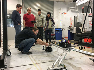 Dr. William Dally, a University of North Florida civil engineering professor, along with some of his students, operate the complete Surf Rover model scaled to one-quarter the actual size. (Image courtesy of UNF Public Relations.)