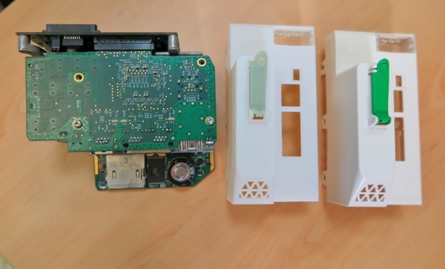 A 3D-printed electric component housing (left), next to the original part (right).