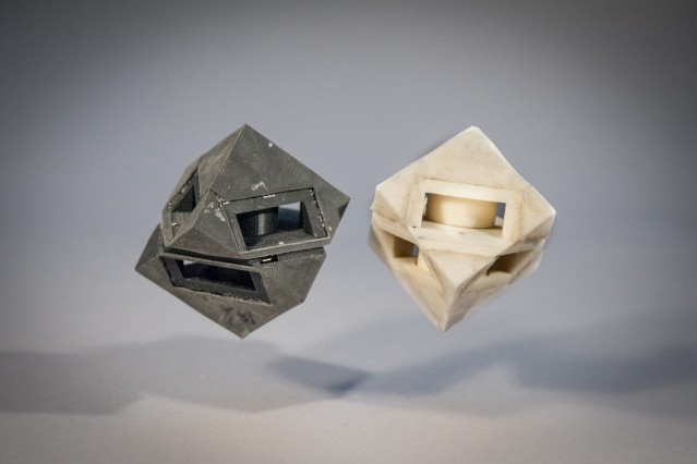 MIT researchers outfitted their cube robot with shock-absorbing “skins” (left) that transfer less than half of the energy that would normally be transferred to the ground. (Image courtesy of Jason Dorfman/MIT CSAIL.)