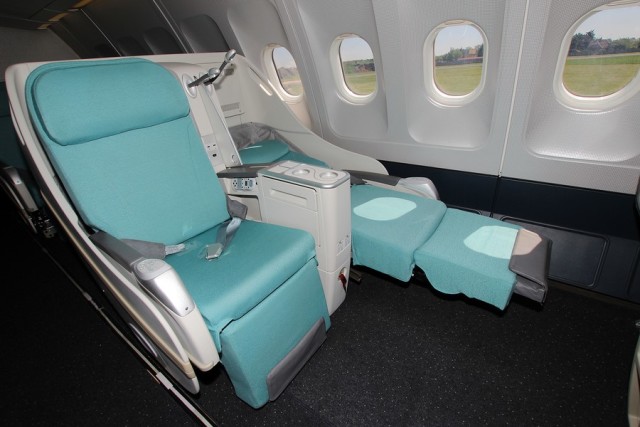 Premium airplane seats, such as this one, contain sophisticated wiring for electronics and electrical systems.