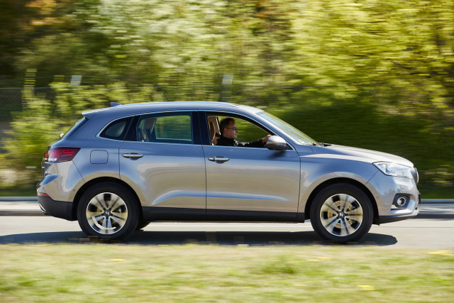 Christian Borgward test drives the BORGWARD BX7 AWD premiere model, the company's newest car model in over 50 years. (Image courtesy Borgward Group AG.)