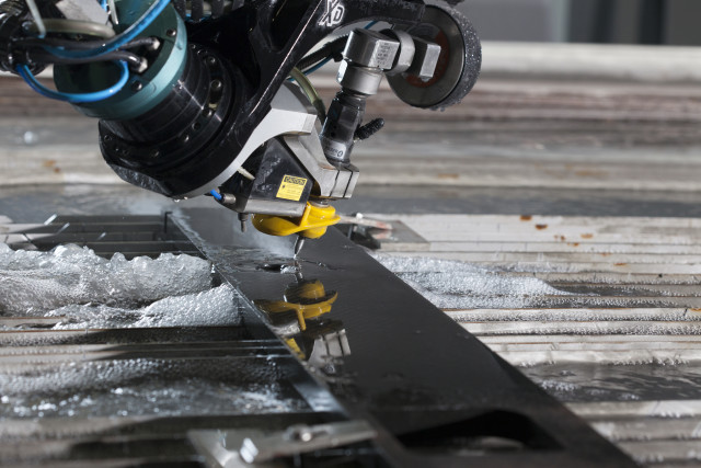 Cheap Vs. Expensive Footballs Cut In Half With Waterjet 