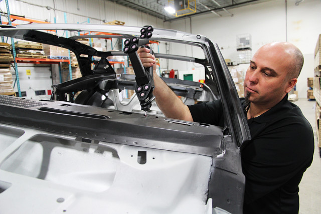 A metrologist performs a body car inspection on the production floor. (Image courtesy of Creaform.)