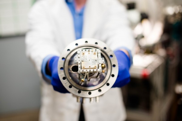 Mechanical engineering PhD student Kurt Terhune holds a nanosatellite thruster, a device which has attracted a lot of attention in aerospace research, but engineers are still working on the best way to use them to propel nanosatellites through space. (Image courtesy of Michigan Tech/Nathan Shaiyen.)