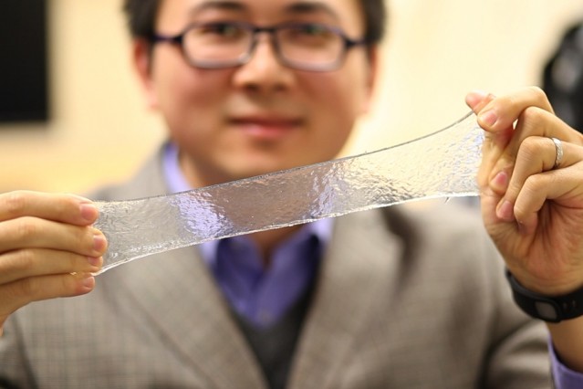 Demonstrating the stretchy hydrogel. (Image courtesy of Melanie Gonick/MIT.)