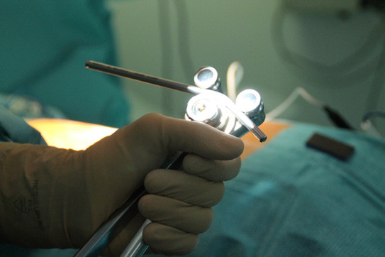 A doctor illustrates the use of a rod-bending device. (Image courtesy of Medicrea.)