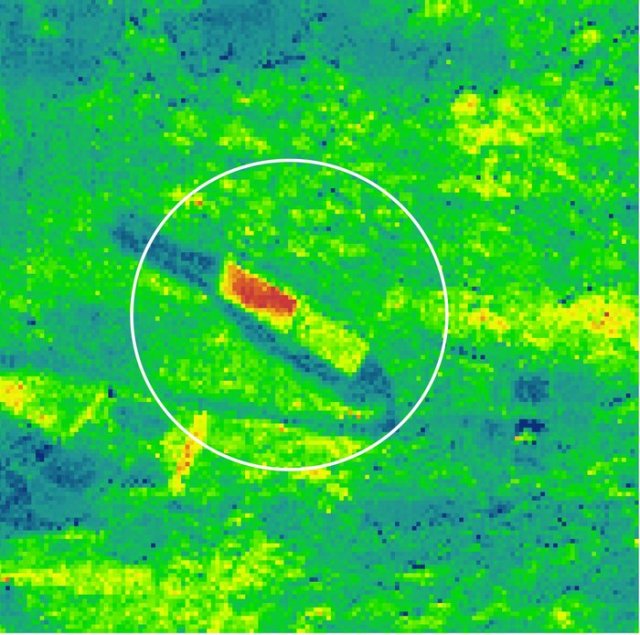 In an experiment to support the development of the FLEX candidate Earth Explorer mission, the HyPlant instrument was used on an aircraft to detect vegetation under stress. The experiment involved rolling out two fields of turf and applying one with a common herbicide and leaving the other untreated. As the image shows, the treated field on the left glows red, emitting more fluorescence compared to the control field on the right and in fact, more than the surrounding vegetation. Fluorescence is generally an indicator of photosynthetic activity. In this case, the herbicide interrupted the plant power systems so that absorbed solar energy could not be used for photosynthesis. To get rid of this energy the plants emitted more fluorescence. By detecting these abnormal peaks of florescence from space, FLEX could offer early warning of stress in plants that may appear healthy to the eye. (Image courtesy of ESA.)