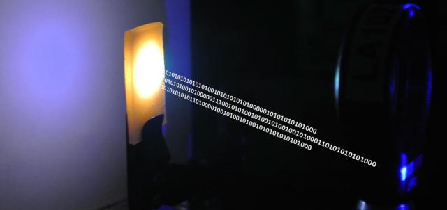 A nanocrystal-based material converts blue laser emission to white light for combined illumination and data communication. (Image courtesy of KAUST.)