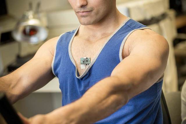 Study co-author Amay Bandodkar demonstrates how the ChemPhys patch works while riding a stationary bike.