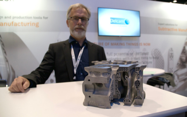 Ulf Lindhe, lead of business development for additive manufacturing with Autodesk, and a 3D-printed engine component optimized for 3D printing using Netfabb.