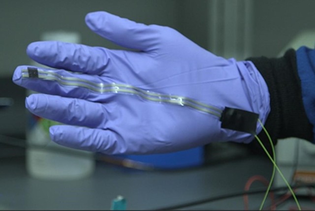 An early prototype demonstrating the stretchy, bendable “skin” that could revolutionize prosthetics, among other applications. (Image courtesy of The American Chemical Society.)