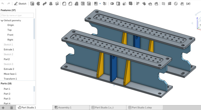 Onshape's design window.A classic feature tree on the left and design window on the right. All the menu options are splattered at the top of the screen.