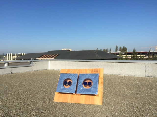 A thin, patterned silica material allows sunlight to pass through, while trapping and releasing heat to increase solar cell efficiency. (Image courtesy Aaswath Raman.)